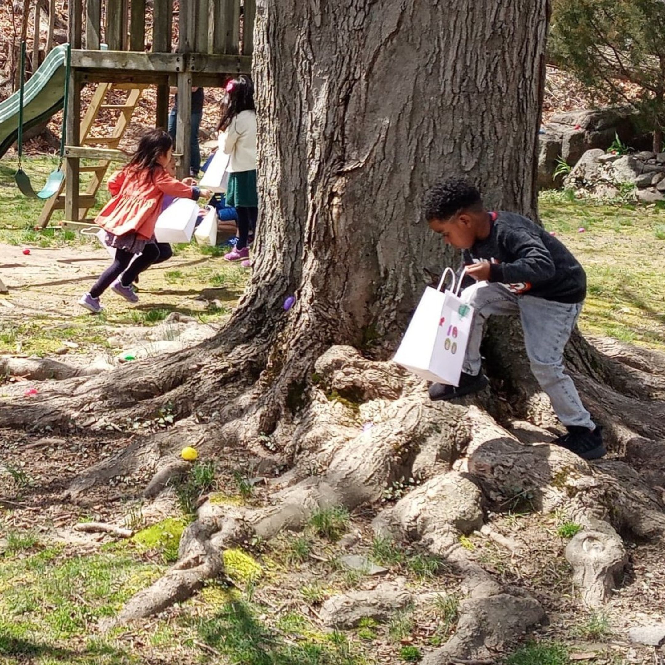Kids hunting for Easter eggs on Easter Sunday