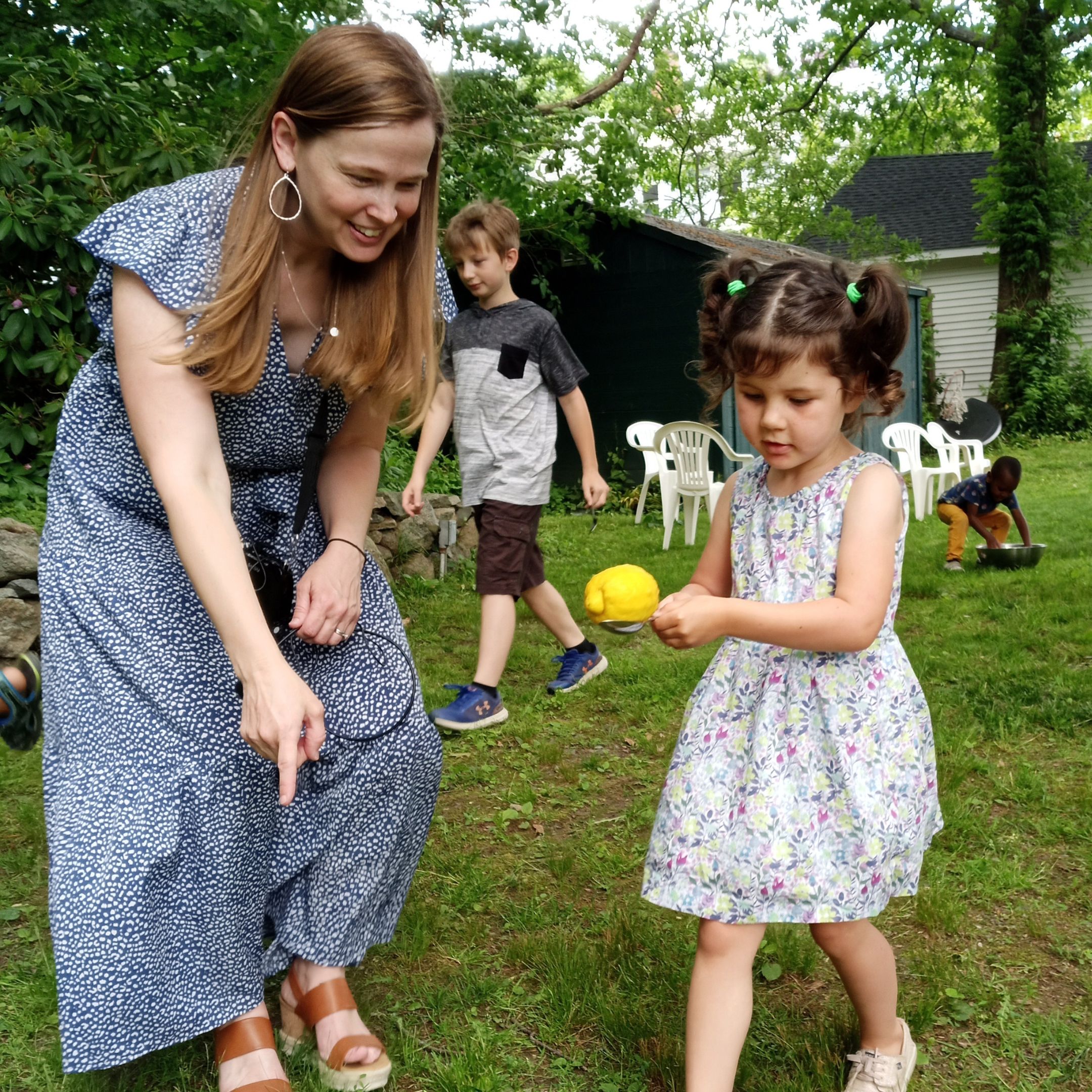 Young girl playing a lemon themed game on Granite City's annual lemonade sale fundraiser