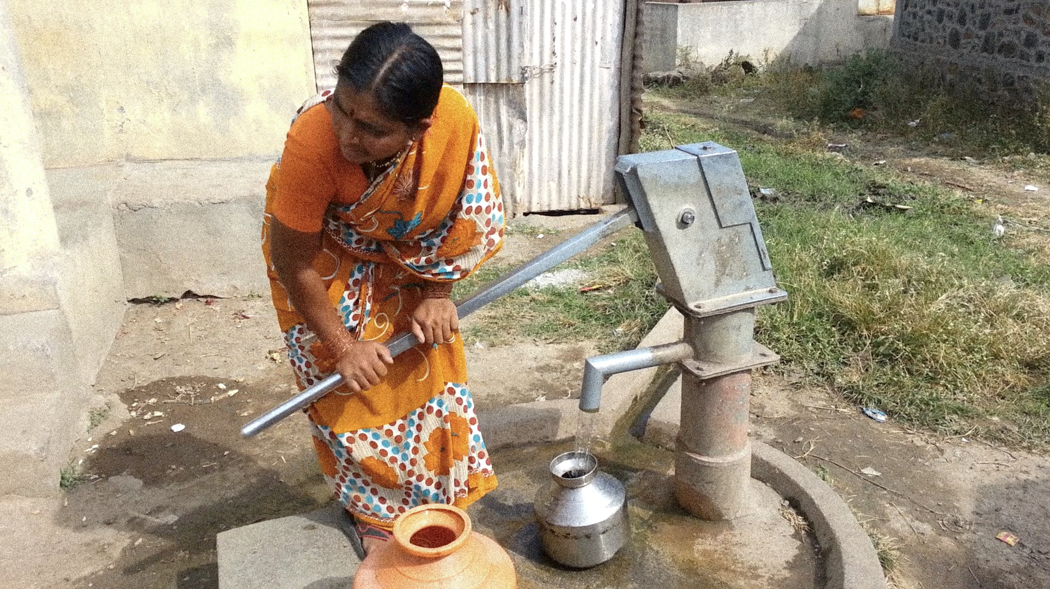 Women pumping water