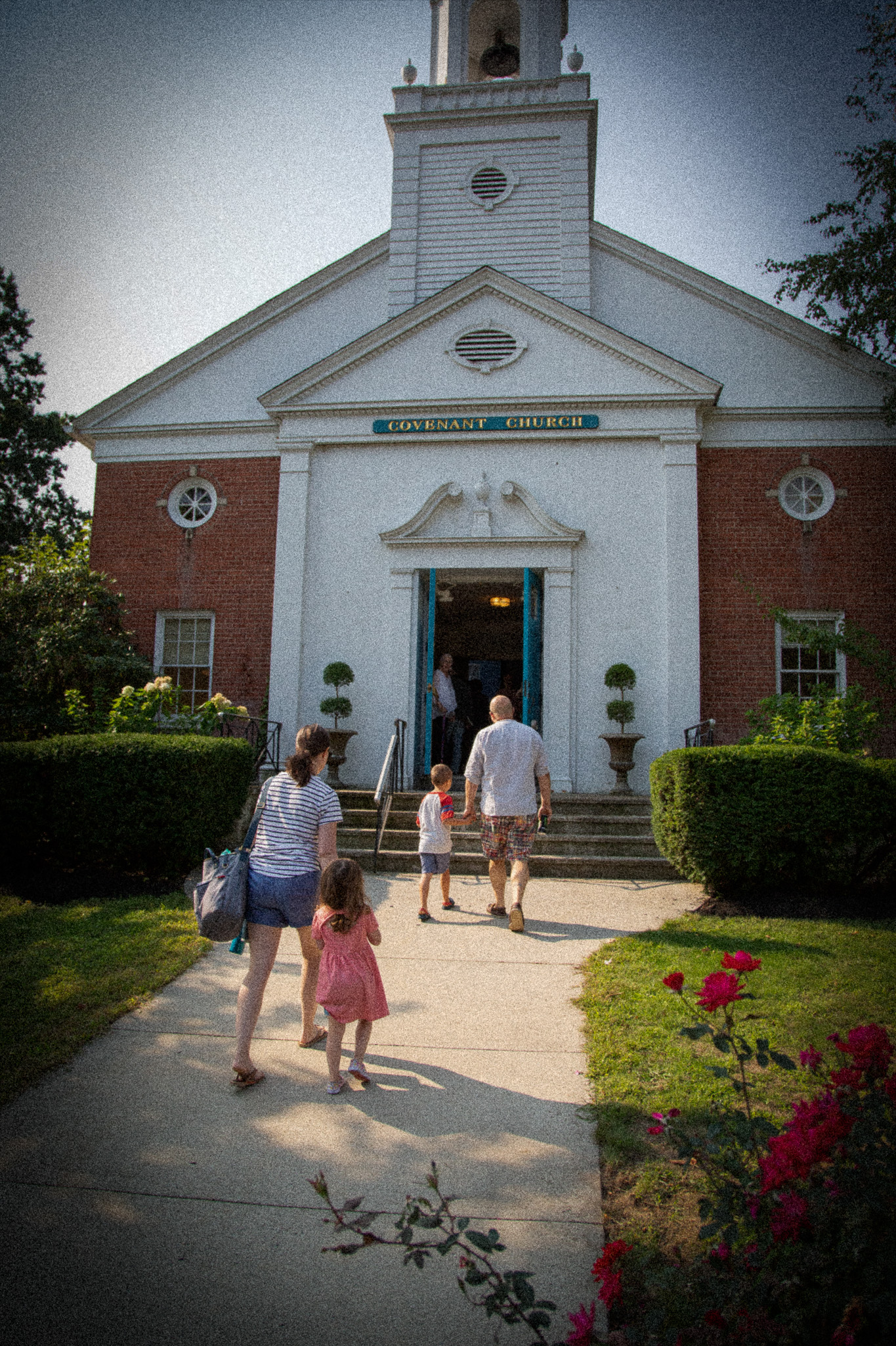 family walking into granite city church front door