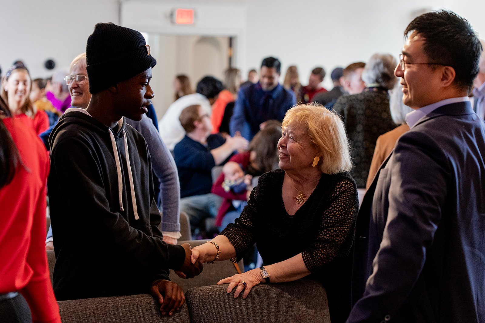 Members greet each other at Granite City Church in Quincy, MA